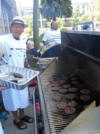 Chef extraordinaire: Ken Kwong, mental health nurse, flipped burgers for a hungry crowd.