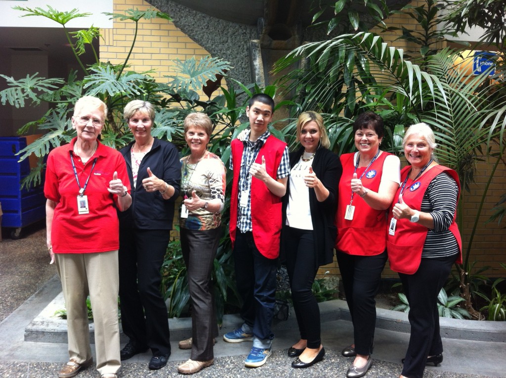 Richmond Hospital/Healthcare Auxiliary Volunteers and RH Volunteer Resources staff celebrate the nomination with a thumbs up